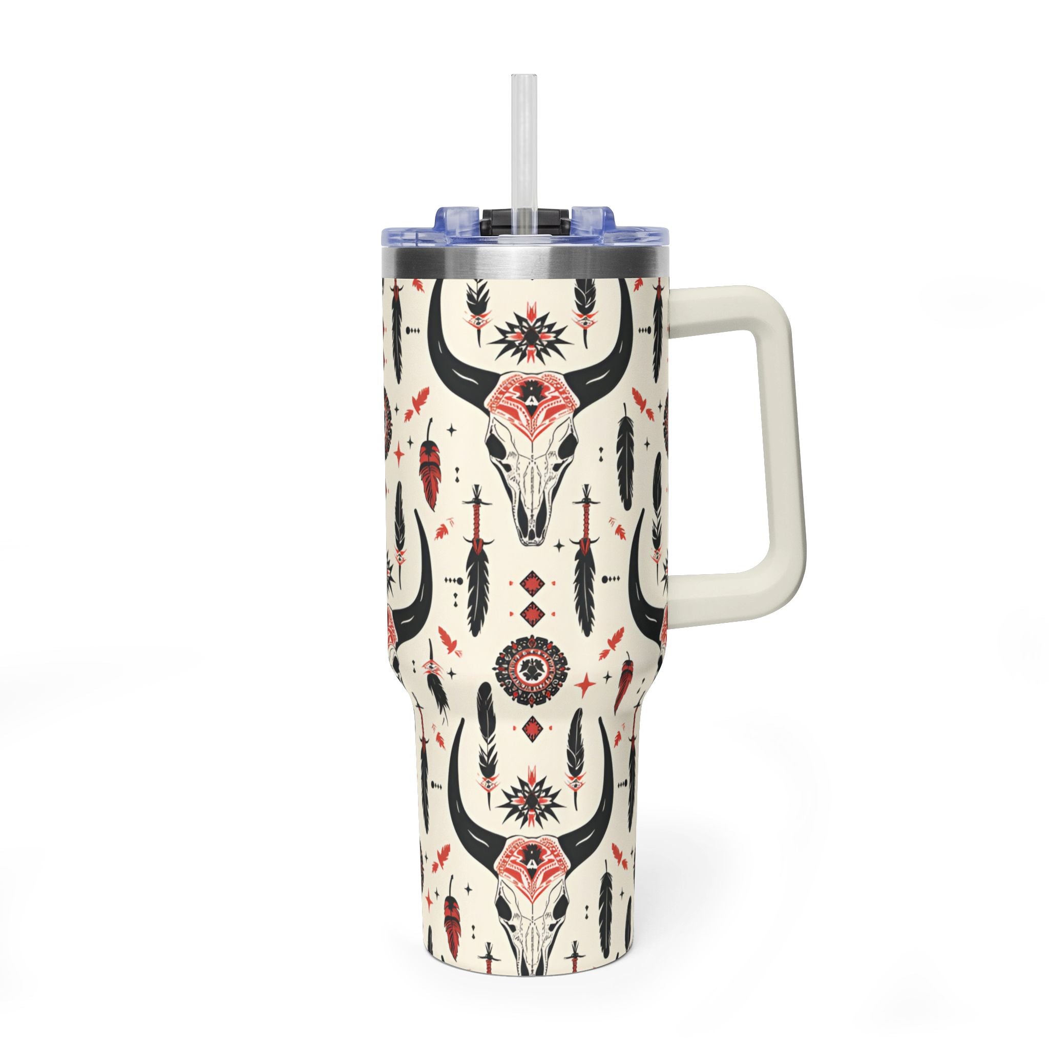 A handleless tumbler with a straw, decorated with a southwestern pattern featuring a central bull skull, feathers, and geometric designs on a cream background.